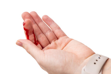 Blood flows down the finger of the hand, isolated on a white background. finger with a fresh cut...
