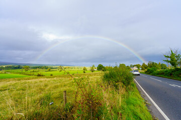 Countryside, road, and a rainbow, in Scotland