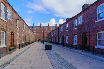 Alley with old red bricks buildings, Ancoats neighborhood, Manchester