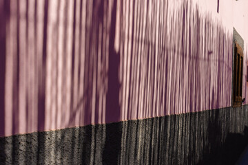 background of a wall with shadows on it