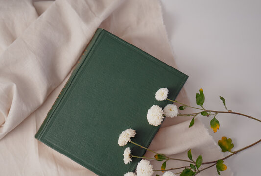 Old vintage book flat lay with flower