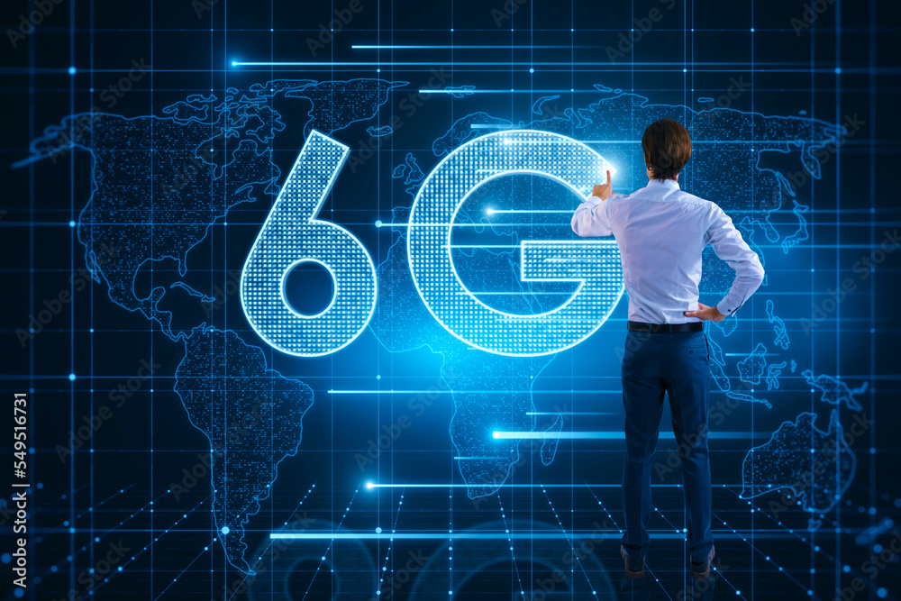 Poster Back view of young man using glowing 6G hologram with map on blurry background. Wireless internet and web speed concept.