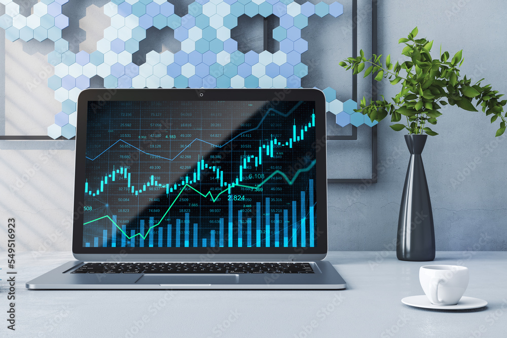 Poster Close up of desktop with laptop and glowing business chart hologram and index on screen. Blurry office background with coffee cup, plant and picture. Finance, trade and invest concept. 3D Rendering.