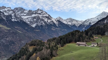 Fototapeta na wymiar Swiss Alps view from Mount Pilatus, Lucerne Switzerland. Mounts with white gray clouds sky