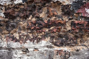 old and eroded brick was with much paint and wear.