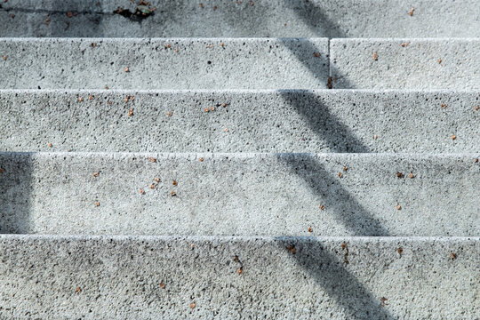 Concete steps and geometric shadow pattern.