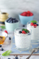 Greek yogurt in glasses with berries and quinoa	