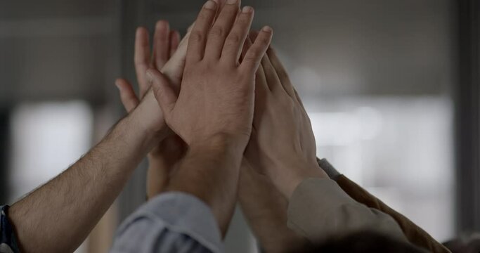 Colleagues giving each other a high five