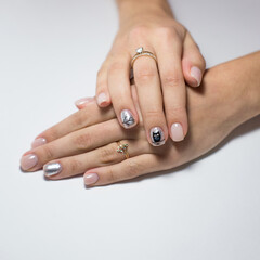 Nail Polish. Modern style pink Nail Polish.Stylish pastel Color white milk Nails hold. Classic wedding bride nails design.Stylish trendy female manicure. Beautiful young woman hand.