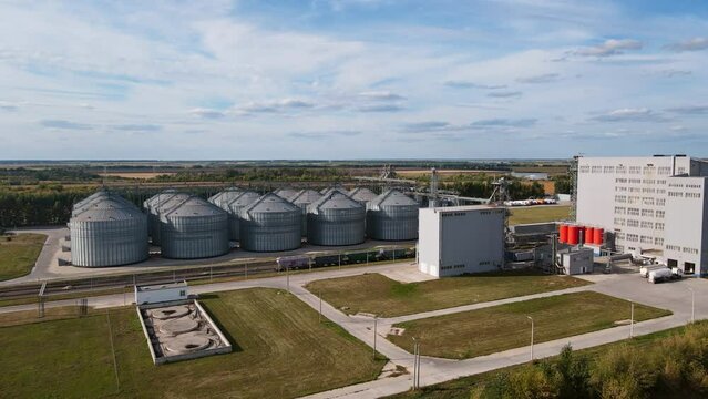 Complex silo installations for the storage of grain on agro-processing manufacturing plant. Aerial wide view