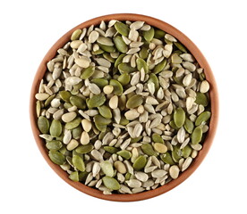 Mix seeds, pumpkin, sunflower seeds and pine nuts in clay pot isolated on white, top view