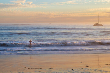 woman at sunset at the beach
