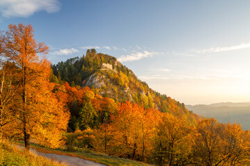 View of autumn landscape with The ruin of the medieval Vrsatec castle at sunset. The Vrsatec National Nature Reserve in the White Carpathian Mountains, Slovakia, Europe.
