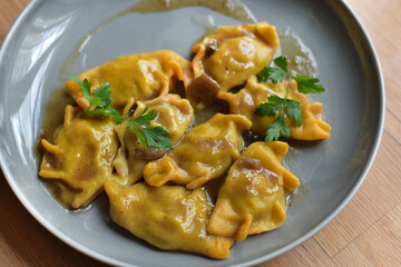 Dumplings with sauce. Restaurant service