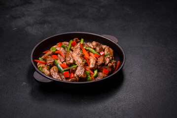 Delicious Asian teriyaki meat with red and green bell peppers