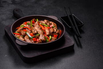 Delicious Asian teriyaki meat with red and green bell peppers