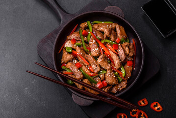 Delicious Asian teriyaki meat with red and green bell peppers