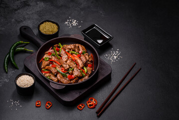 Delicious Asian teriyaki meat with red and green bell peppers