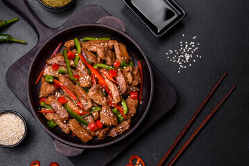 Delicious Asian teriyaki meat with red and green bell peppers