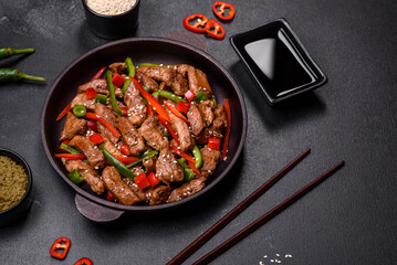 Delicious Asian teriyaki meat with red and green bell peppers