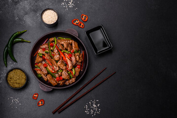 Delicious Asian teriyaki meat with red and green bell peppers