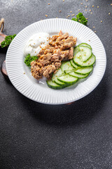 tuna salad, cucumber and yogurt or sour cream fresh delicious snack healthy meal food snack on the table copy space food background rustic top view keto or paleo diet veggie vegan or vegetarian food 