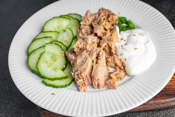 tuna salad, cucumber and yogurt or sour cream fresh delicious snack healthy meal food snack on the table copy space food background rustic top view keto or paleo diet veggie vegan or vegetarian food 