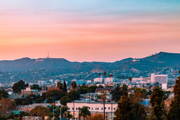 Fototapeta na wymiar Los Angeles, California landscape with the hollywood sign and griffith observatory in the background during sunset.