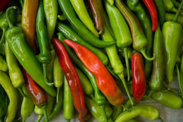 Hot chili pepper background. Red and green peppercorns as a background. Healthy food concept.