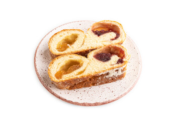 Homemade sweet bun with apricot jam isolated on white. side view.