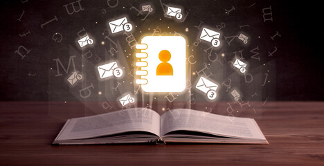 Open book with social networking icons above