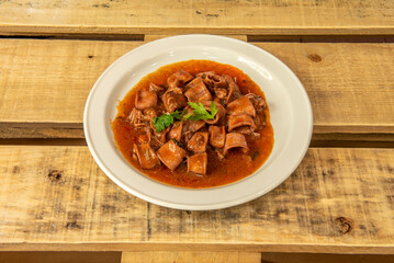 baby squid in its ink are a dish made with small pieces of squid, including the tentacles, cooked in their own ink