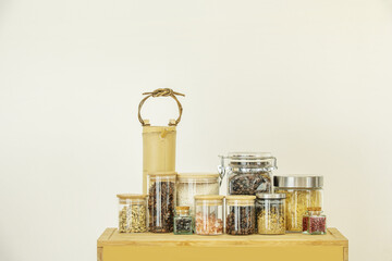 Spice and condiment jars on bamboo wooden box