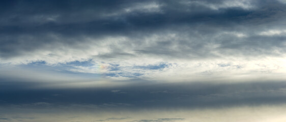 Dark rain clouds and morning sun.