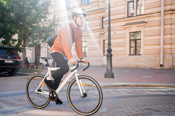A man on a bicycle goes to work urban eco transport
