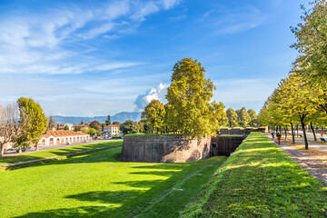Lucca, Italy. Picturesque promenade on the medieval fortress wall - obrazy, fototapety, plakaty