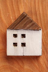 Obraz na płótnie Canvas Miniature old wooden cracked damaged house