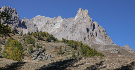 View of the scenic Valee de la Claree in the French Alps with Massif de Cerces mountains on either side of the valley, near Briancon, France