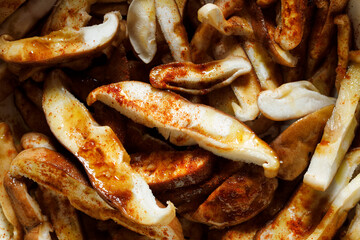 Fresh sliced shitake mushrooms with spices, close up view