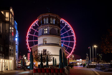 Night scenery of Weihnachtsmarkt, Christmas Market and ferris wheel at Burgplatz square in...