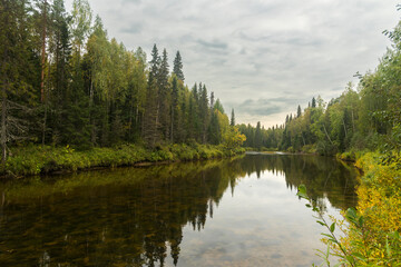 a quiet river Sotka with clear water in a wild forest in the north of the Arkhangelsk region in Russia.