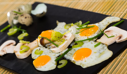 Easy vegetarian breakfast - fried eggs with mushrooms and greens