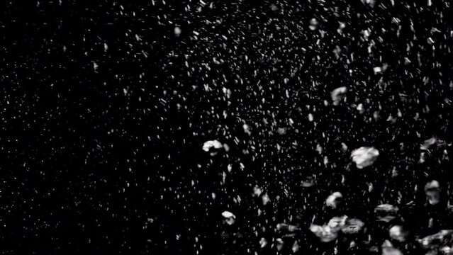 Slow Motion Video Of Bubbles In Boiling Water Of A Kettle. The Process Of Boiling Water On A Black Background. High Quality 4k Footage