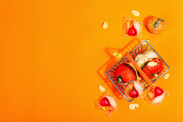 Sale concept for machine washing. Capsules with detergent and autumn decor in traditional basket