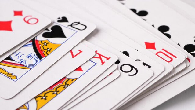 Closeup of plating cards layered down on a yellow background