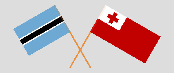 Crossed flags of Botswana and Tonga. Official colors. Correct proportion