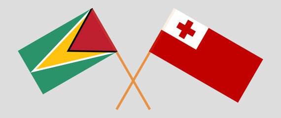 Crossed flags of Guyana and Tonga. Official colors. Correct proportion