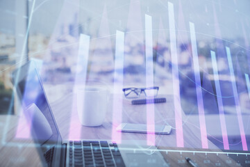 Forex graph hologram on table with computer background. Multi exposure. Concept of financial markets.
