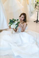 Beautiful bride with wedding flowers bouquet. Portrait of bride with bouquet. Beautiful bride and wedding bouquet.