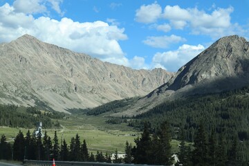 Scenic shot of the Colorado Rocky Mountains with a cloudscape in the background